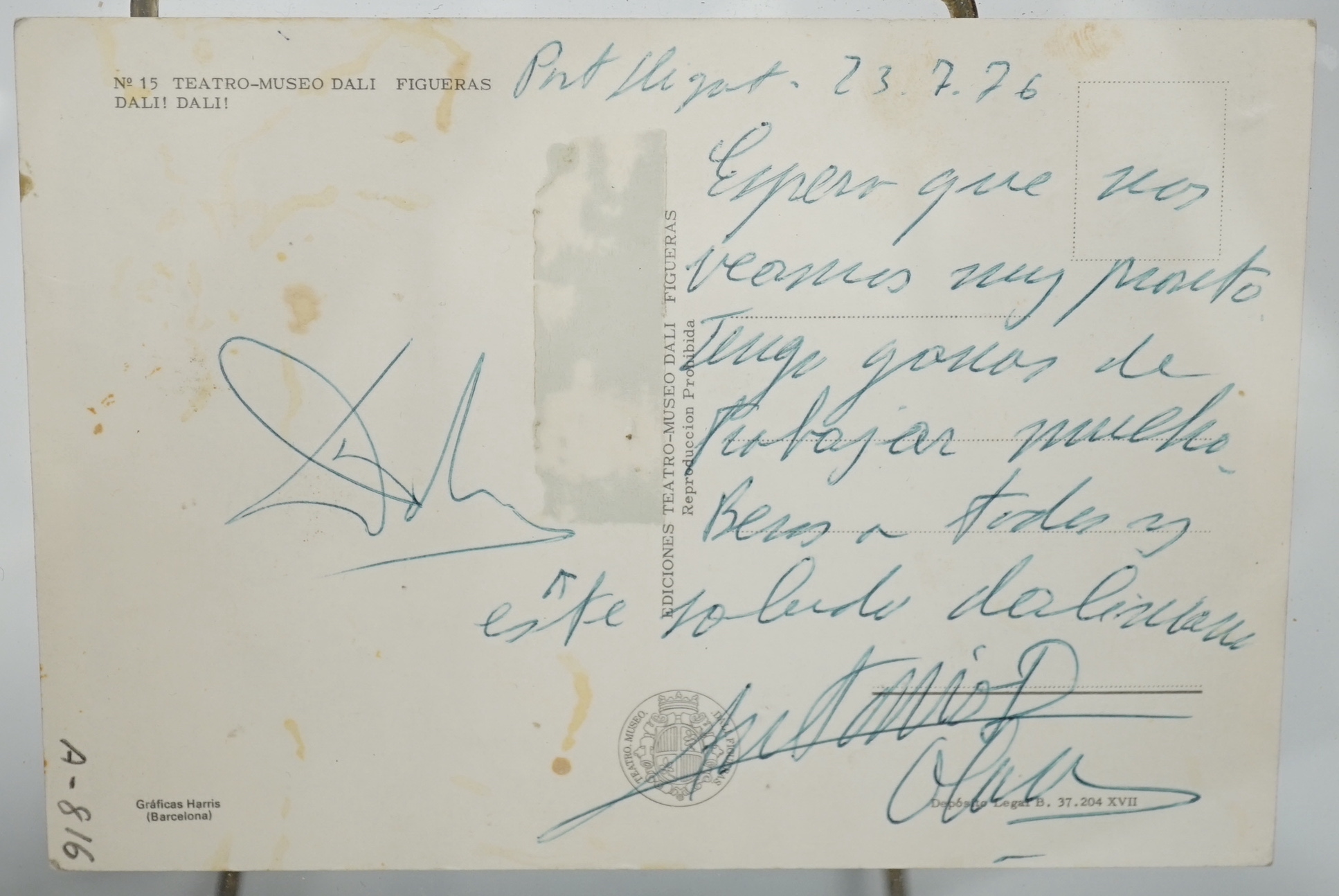 A framed Salvador Dali postcard signed with his autograph on reverse